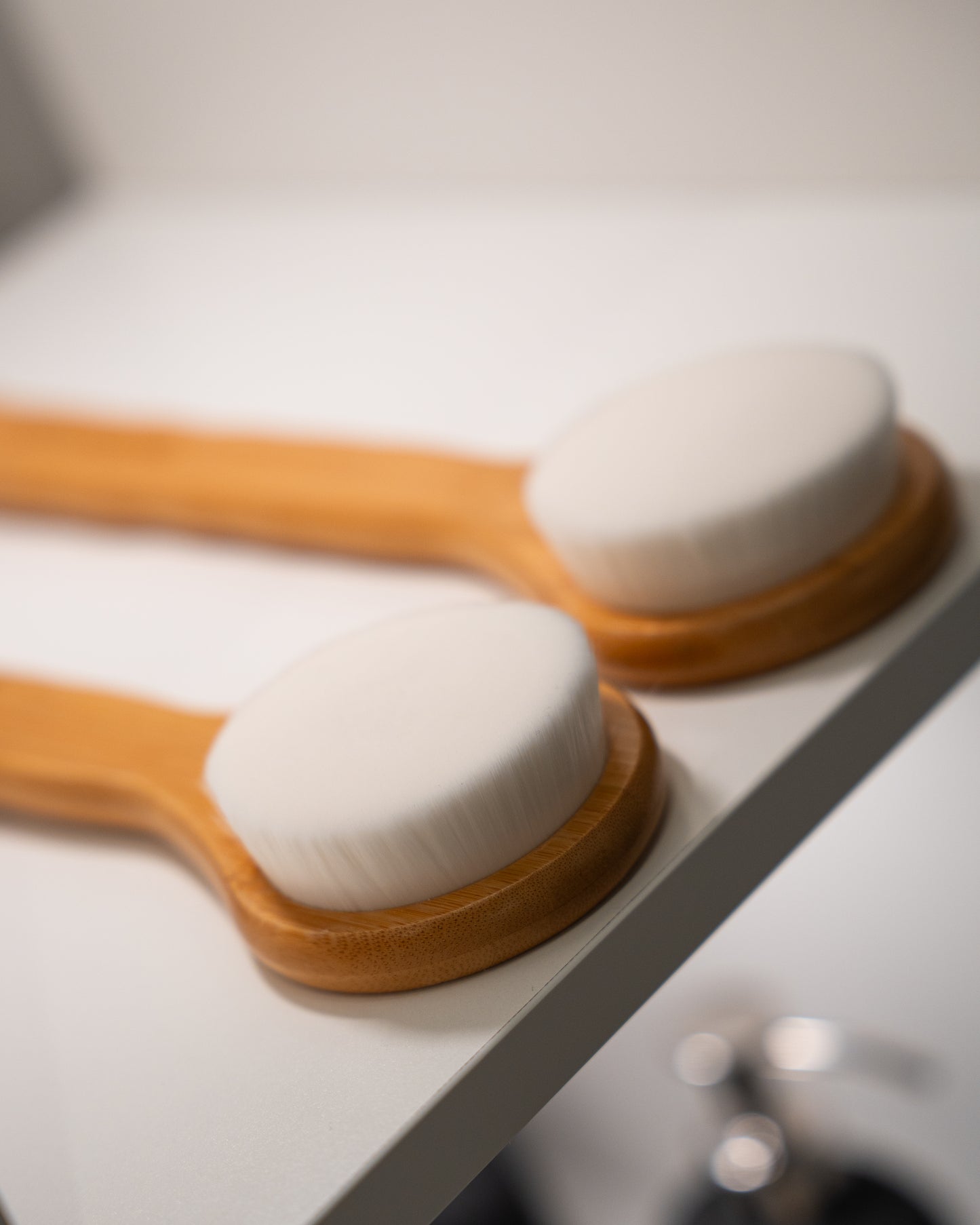 Ultra-fine bristle bamboo body brush — soft enough for daily exfoliation without damaging the skin barrier