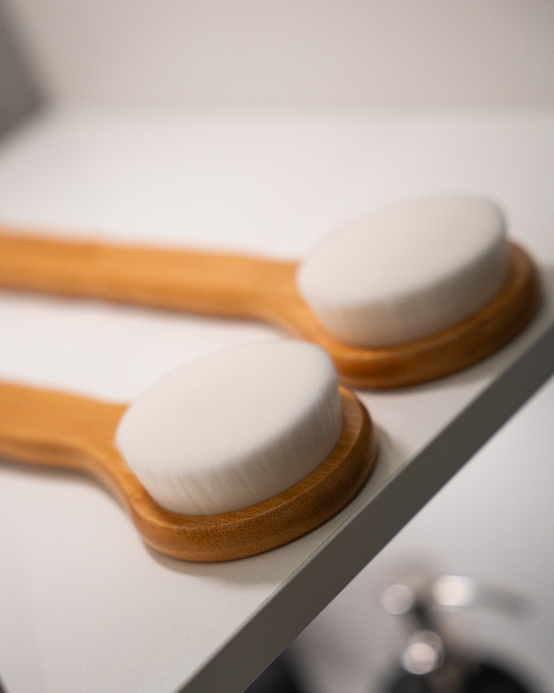 Ultra-fine bristle bamboo body brush — soft enough for daily exfoliation without damaging the skin barrier