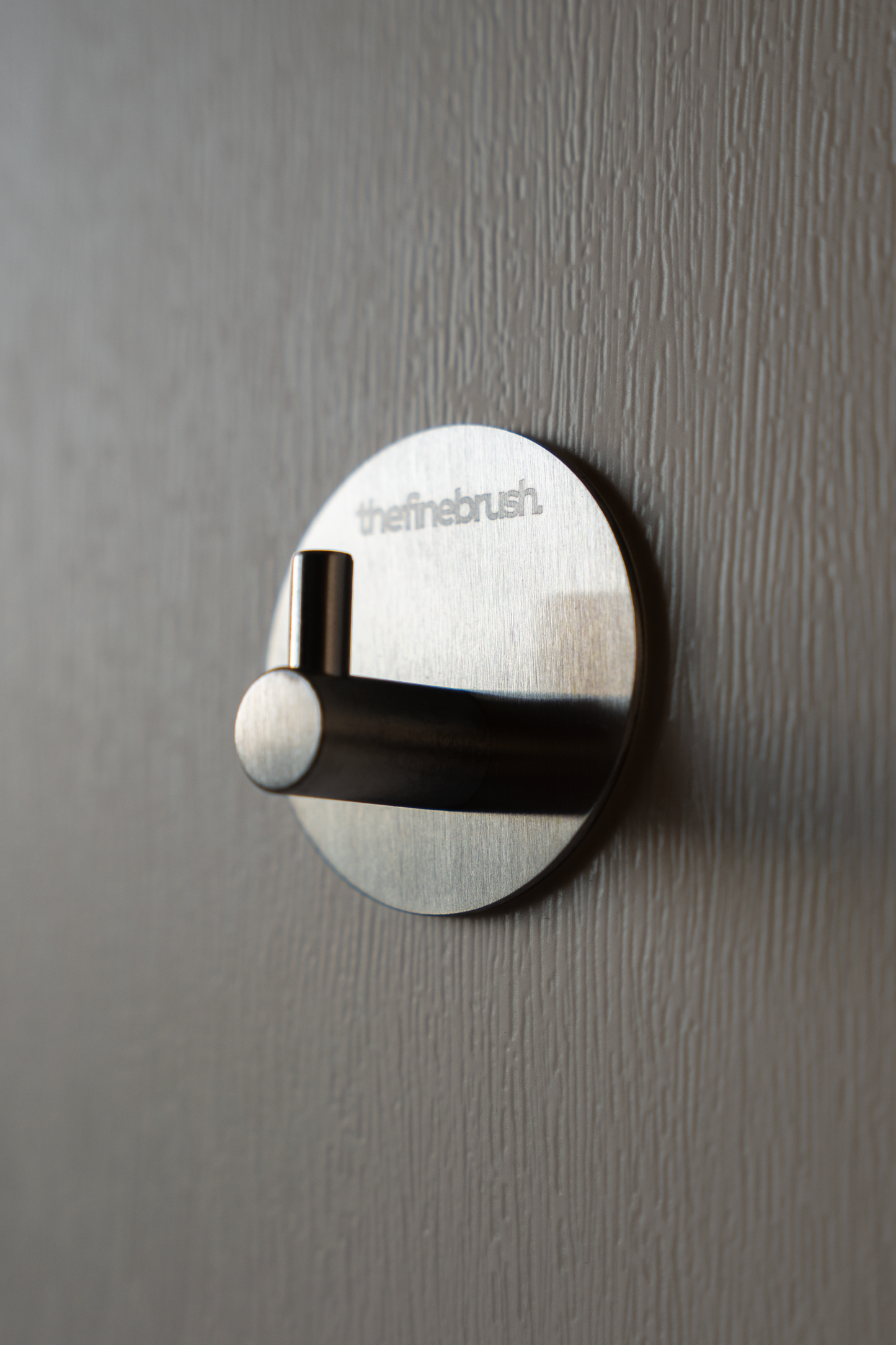 The Fine Hook brushed stainless steel wall hook — waterproof, shower-safe, no drilling required