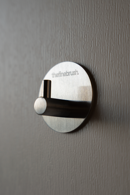 The Fine Hook brushed stainless steel wall hook — waterproof, shower-safe, no drilling required